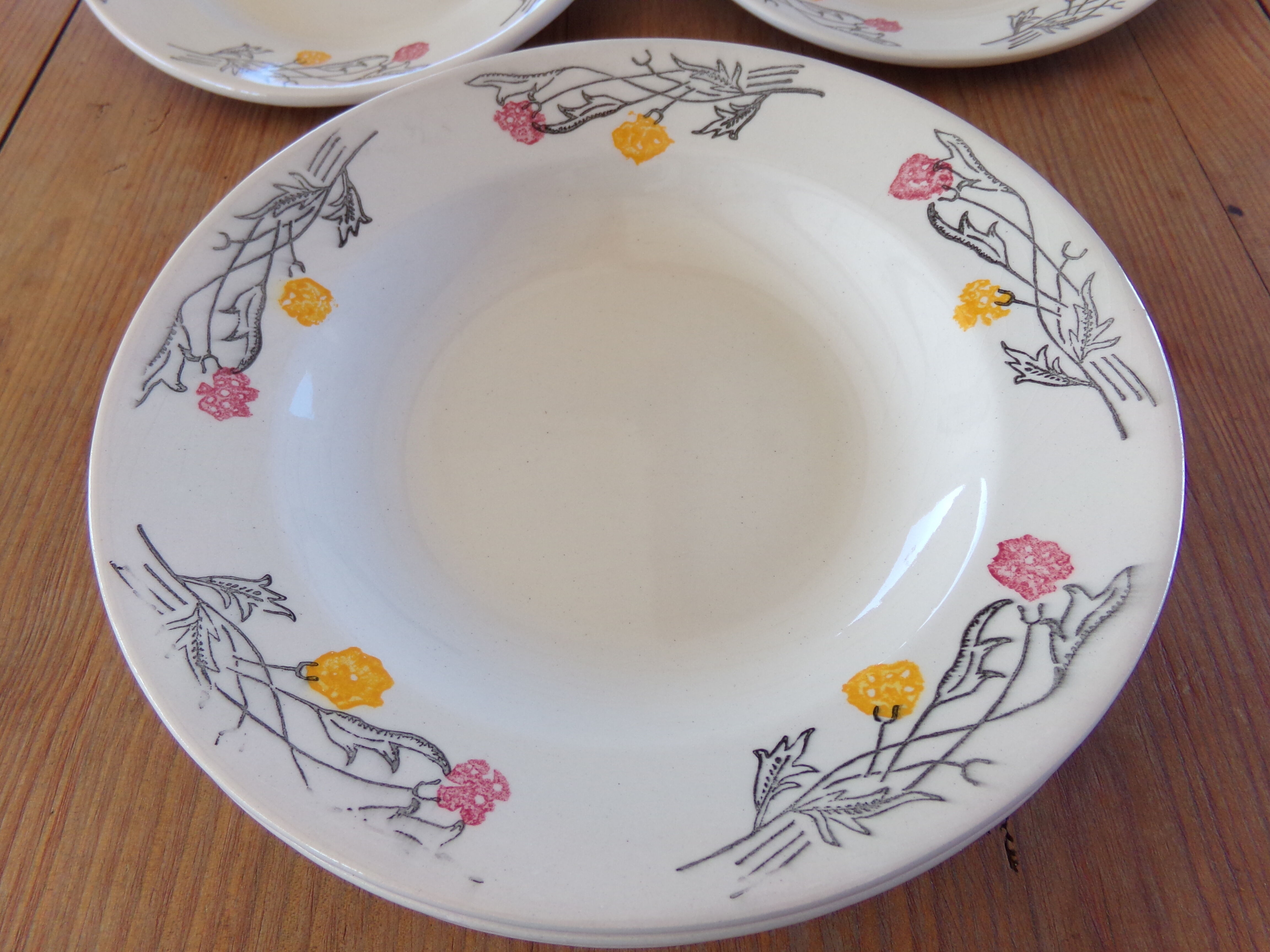 4 hollow plates and 4 old flat plates with floral decoration