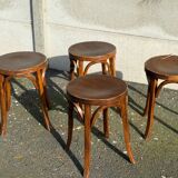 Set of four curved wooden stools stamped Baumann model 92.