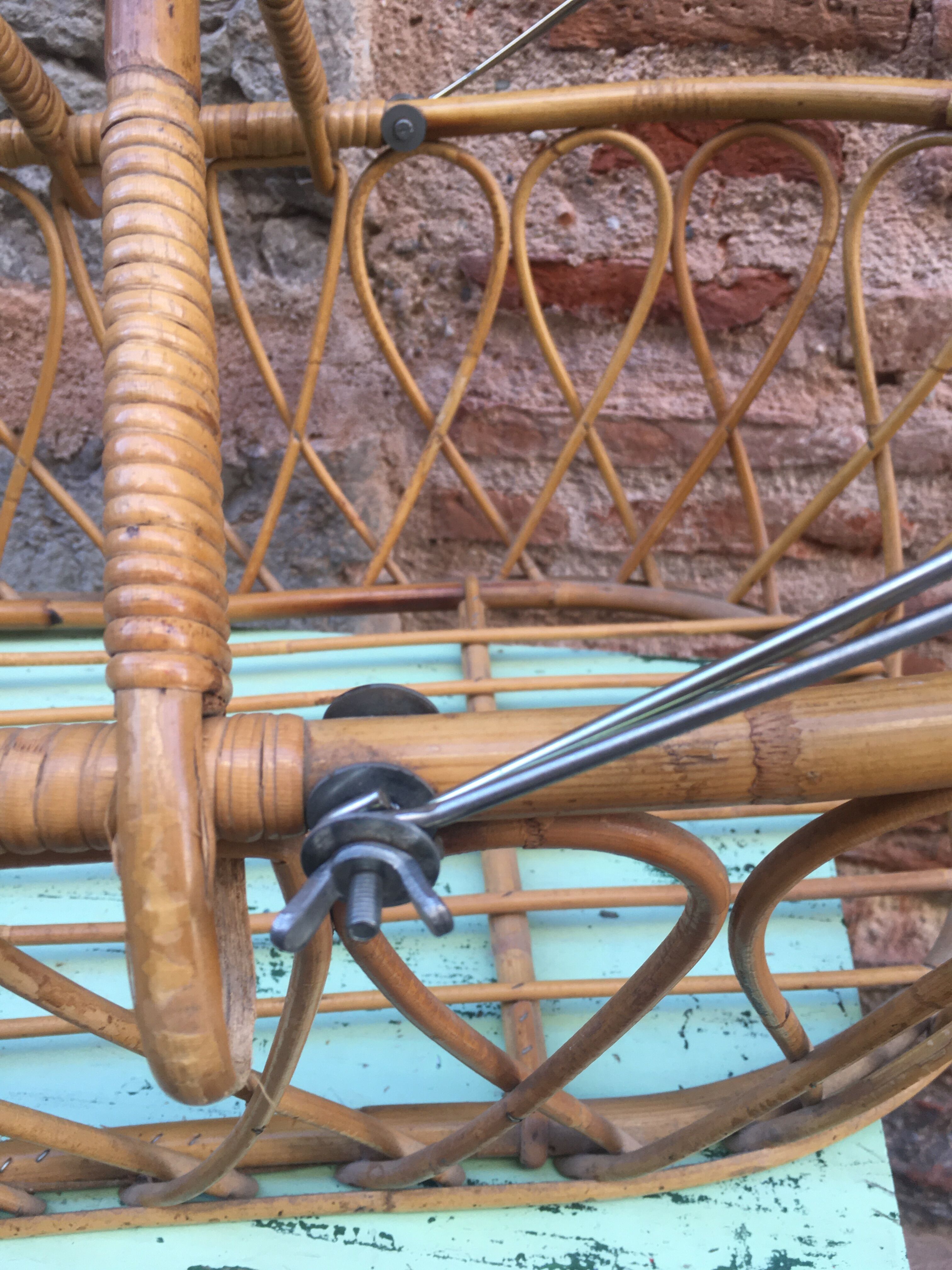Rattan bassinet with hood arches