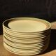 14 assiettes plates en grès, 1970