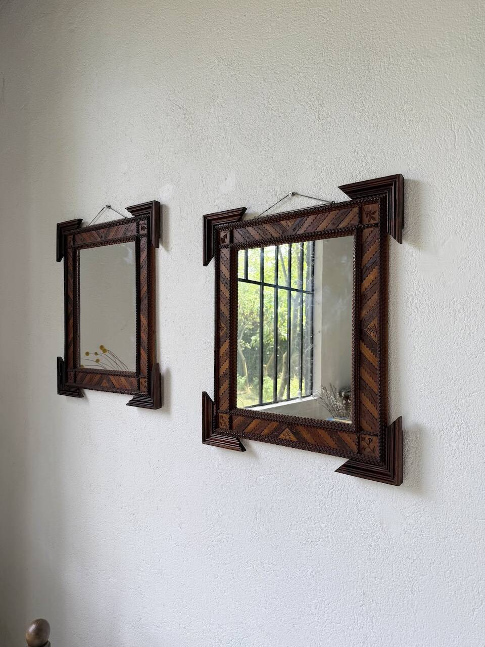 Pair of wooden mirrors in tramp art style