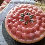 Glazed ceramic dessert plate with strawberry design.