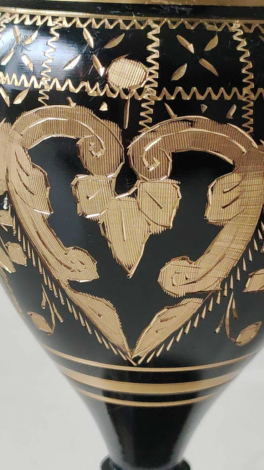 Vintage brass vase with black and gold patina, corolla neck. From India. Mid-20th century. Engraved heart/floral/leafy patterns. High 20 cm