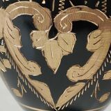 Vintage brass vase with black and gold patina, corolla neck. From India. Mid-20th century. Engraved heart/floral/leafy patterns. High 20 cm