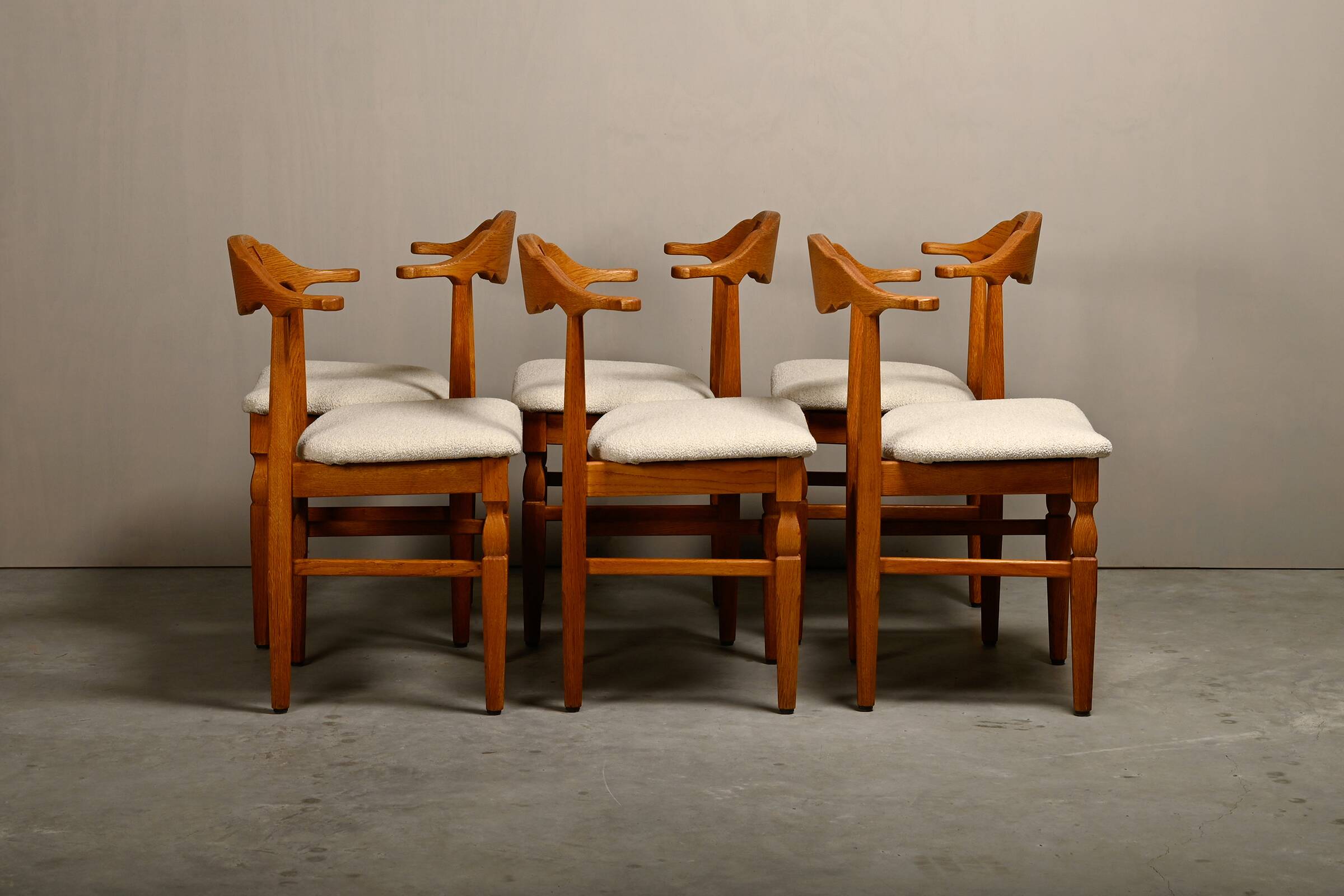 Henning Kjærnulf dining chairs set in Oak and Off White Bouclé, Denmark, 1960s