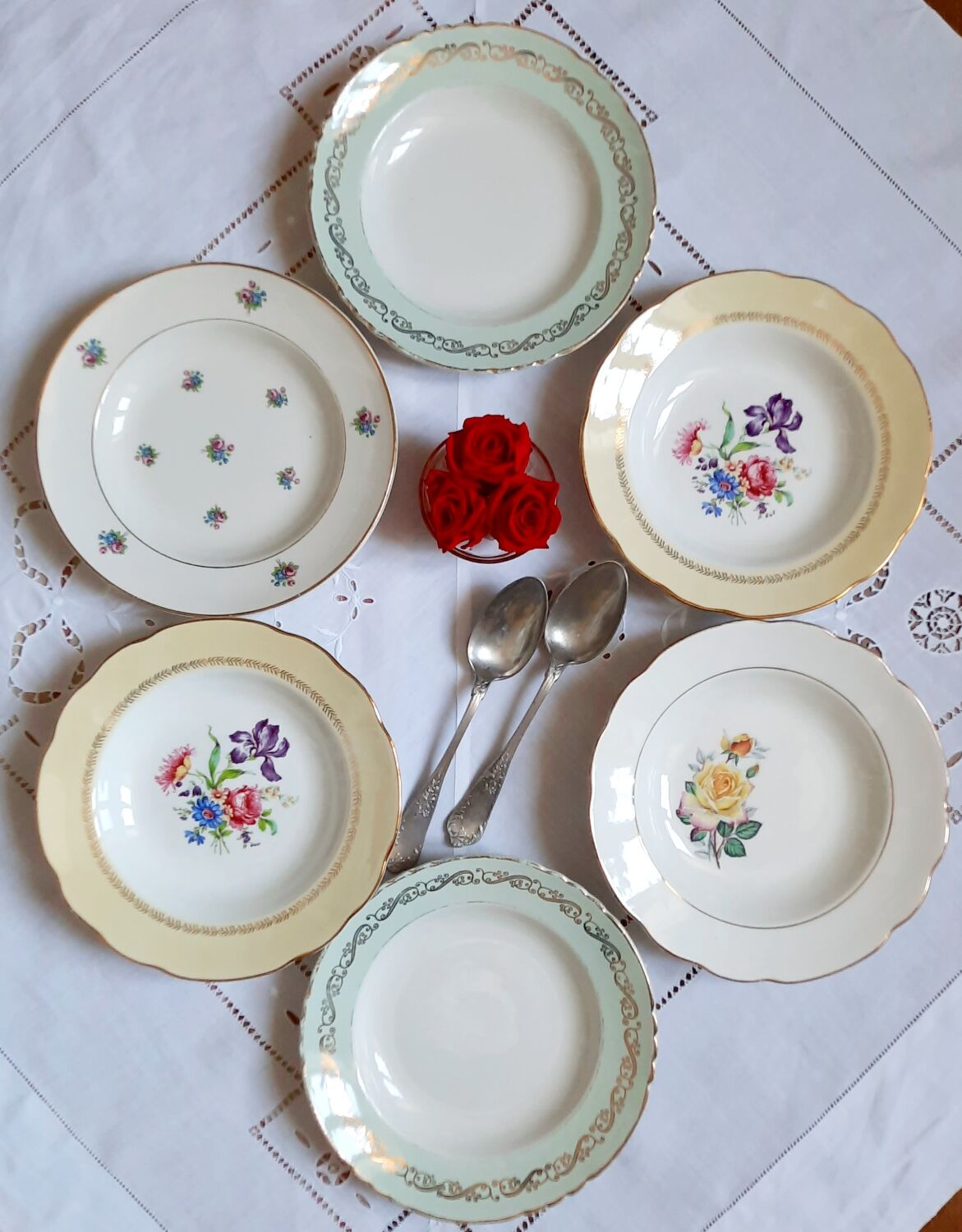 Old hollow plates mismatched in earthenware with gilded edges