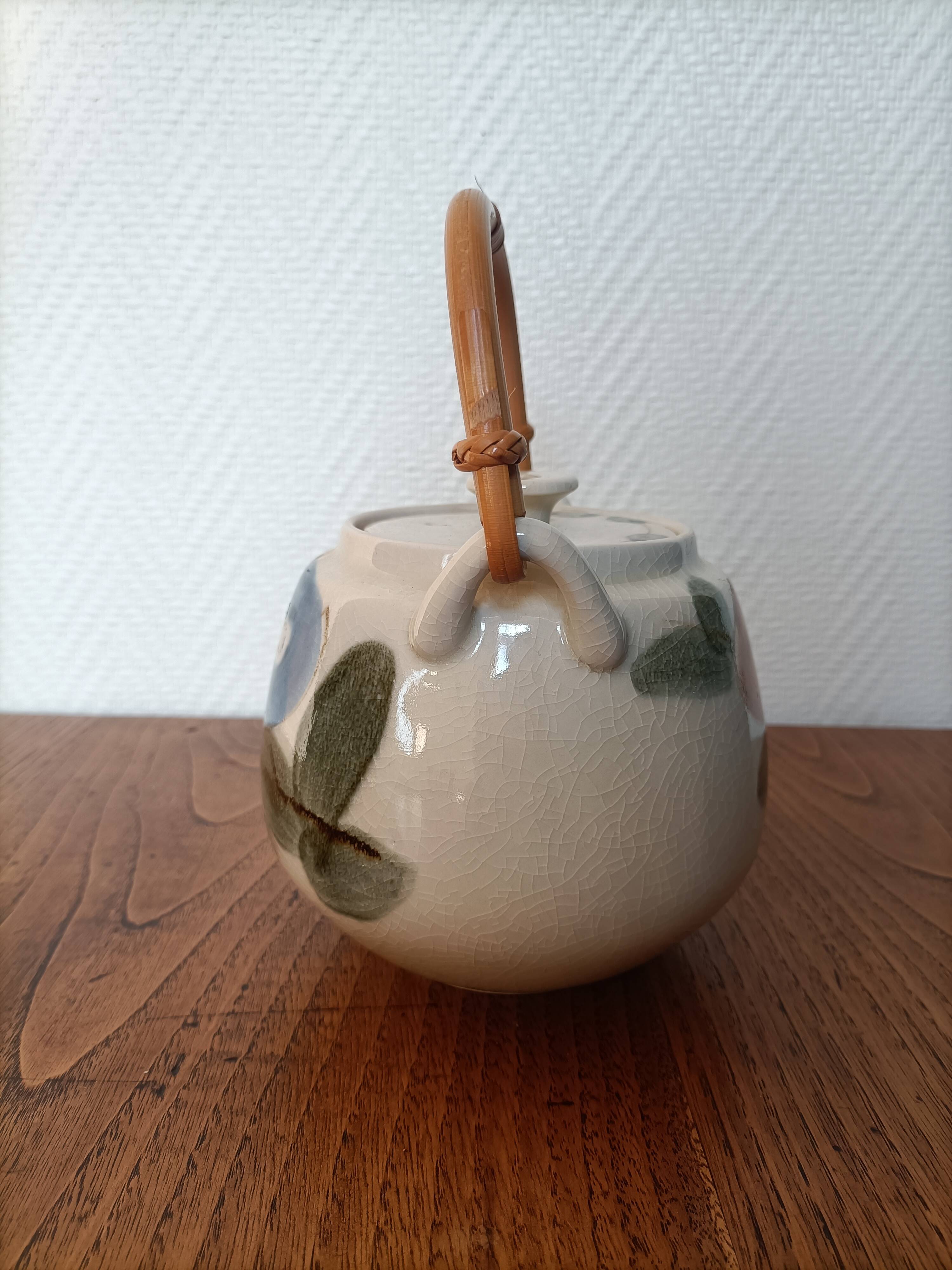 Asian style teapot with bamboo handle