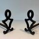 Pair of Cast Iron Chenets with Figurative Anthropomorphic Silhouette, by Raymon