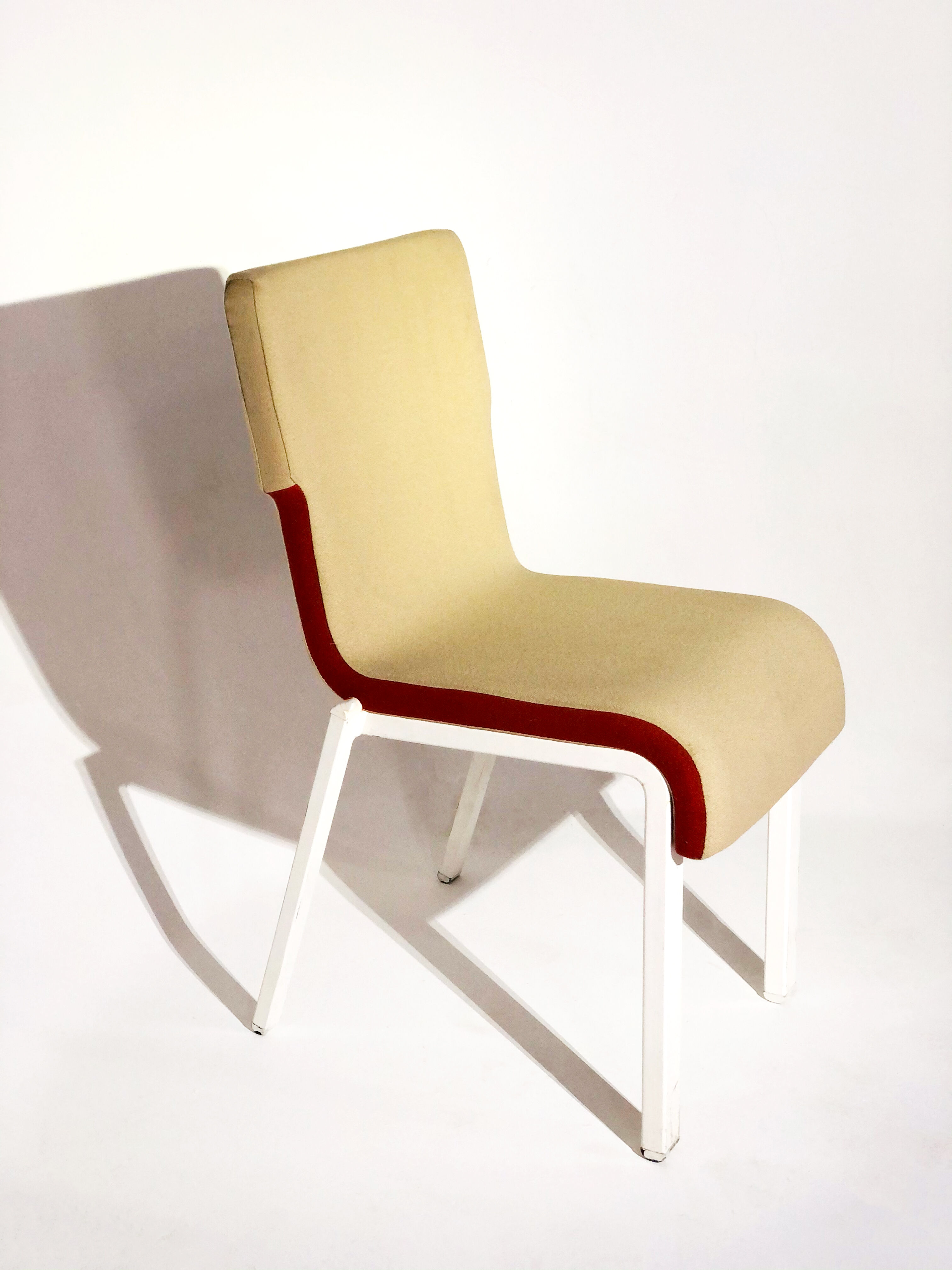 Contemporary design chair in white lacquered fabric and metal