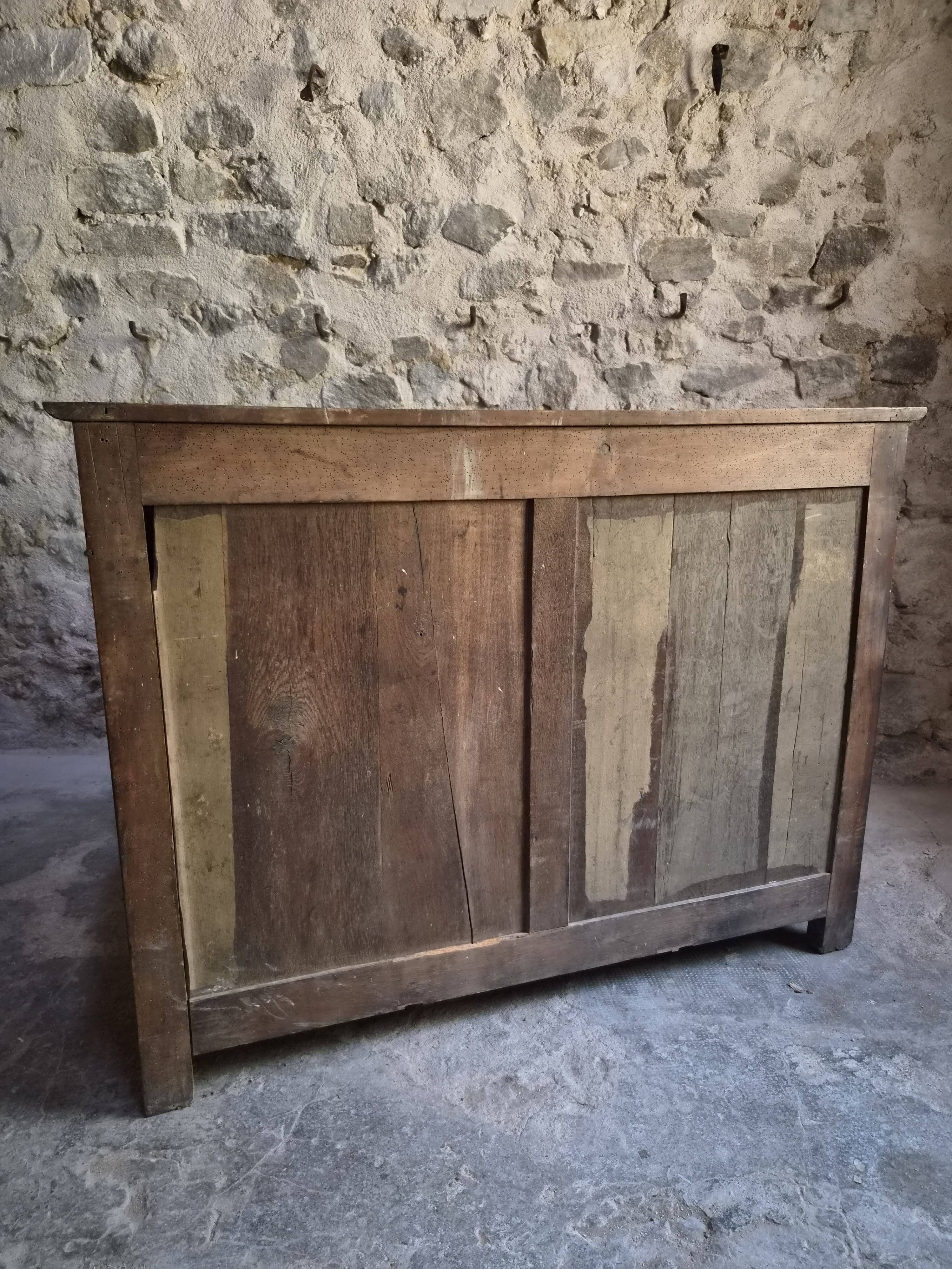 French Louis Philippe walnut buffet with black marble top, France, circa 1840–1860.