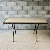 Table made of wrought iron and cement