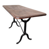 Bistro table with cast iron legs and solid wood top