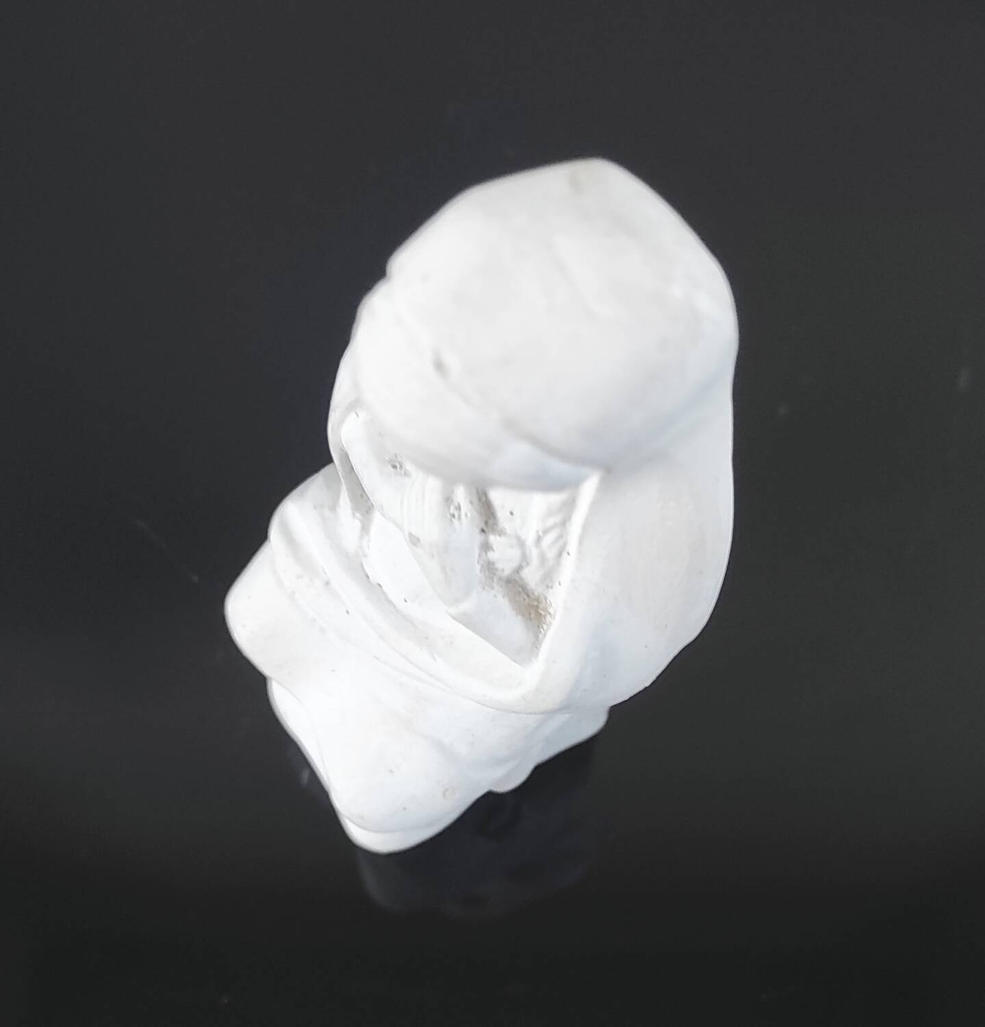 Vintage white plaster statuette of the Virgin Mary.