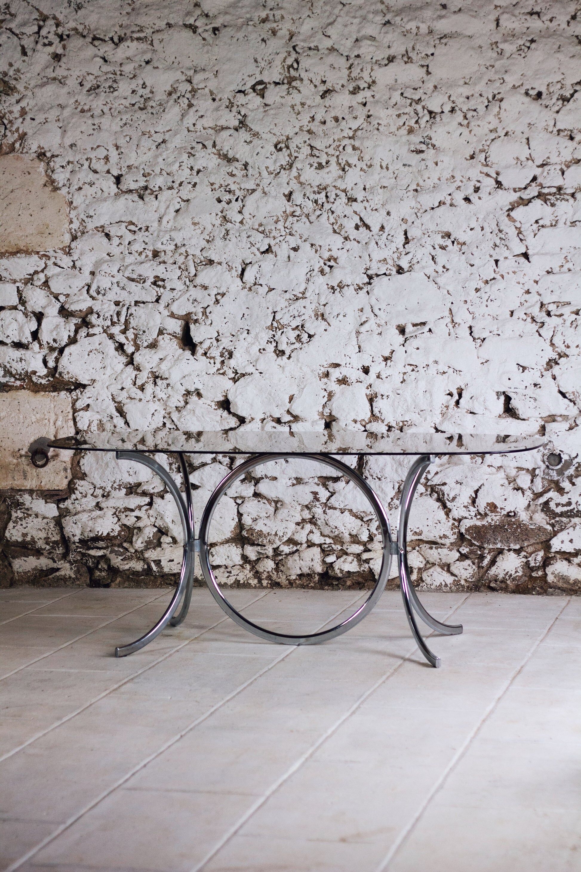 Chrome and smoked glass dining table in the style of Gastone Rinaldi, 1970.