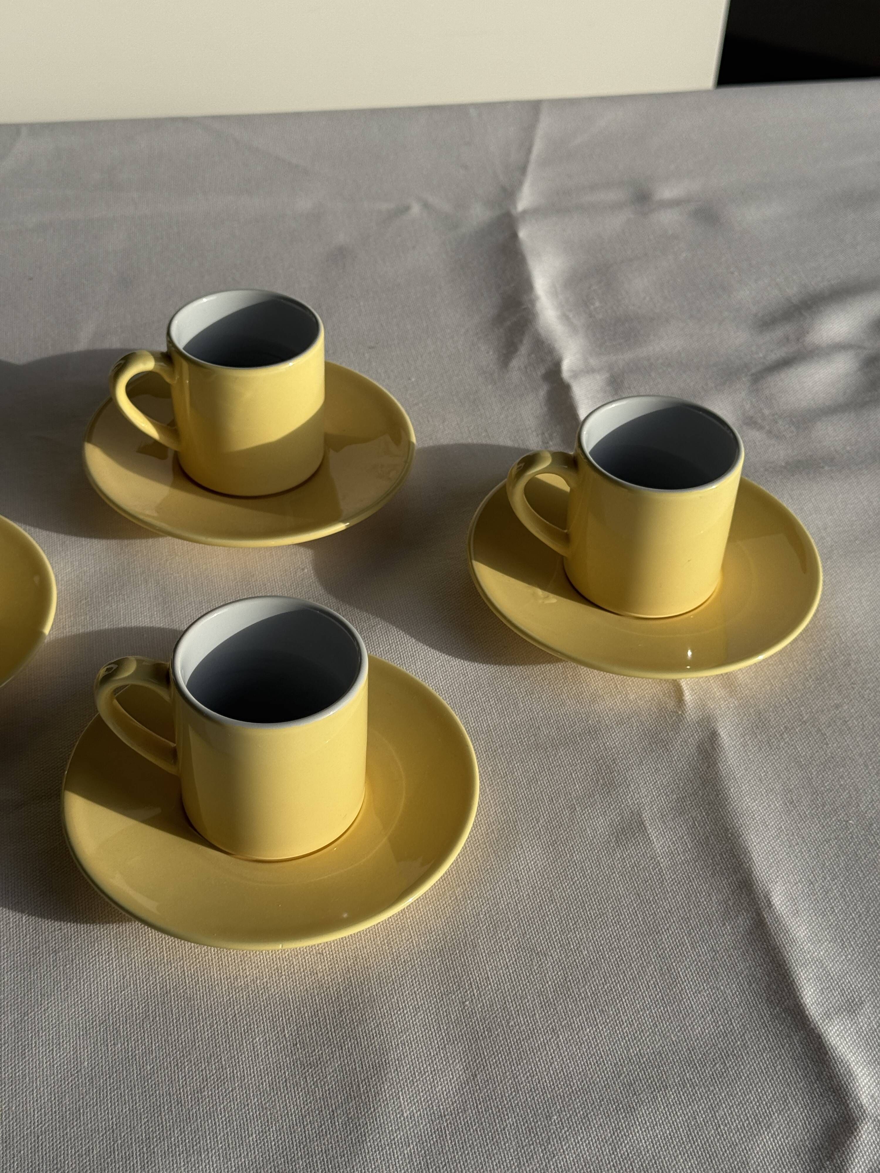 Set of 4 vintage yellow Italian espresso cups and saucers.