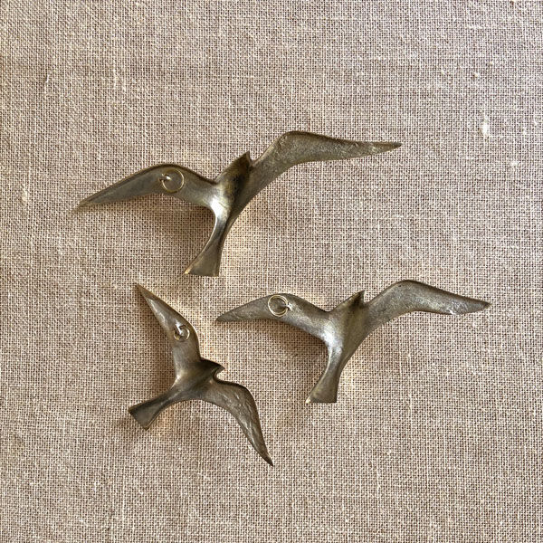 Series of 3 golden brass seagulls to hang