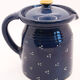 Pitcher and navy blue lid with off-white peas
