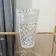 Elegant cut crystal vase in transparent Art Deco style.