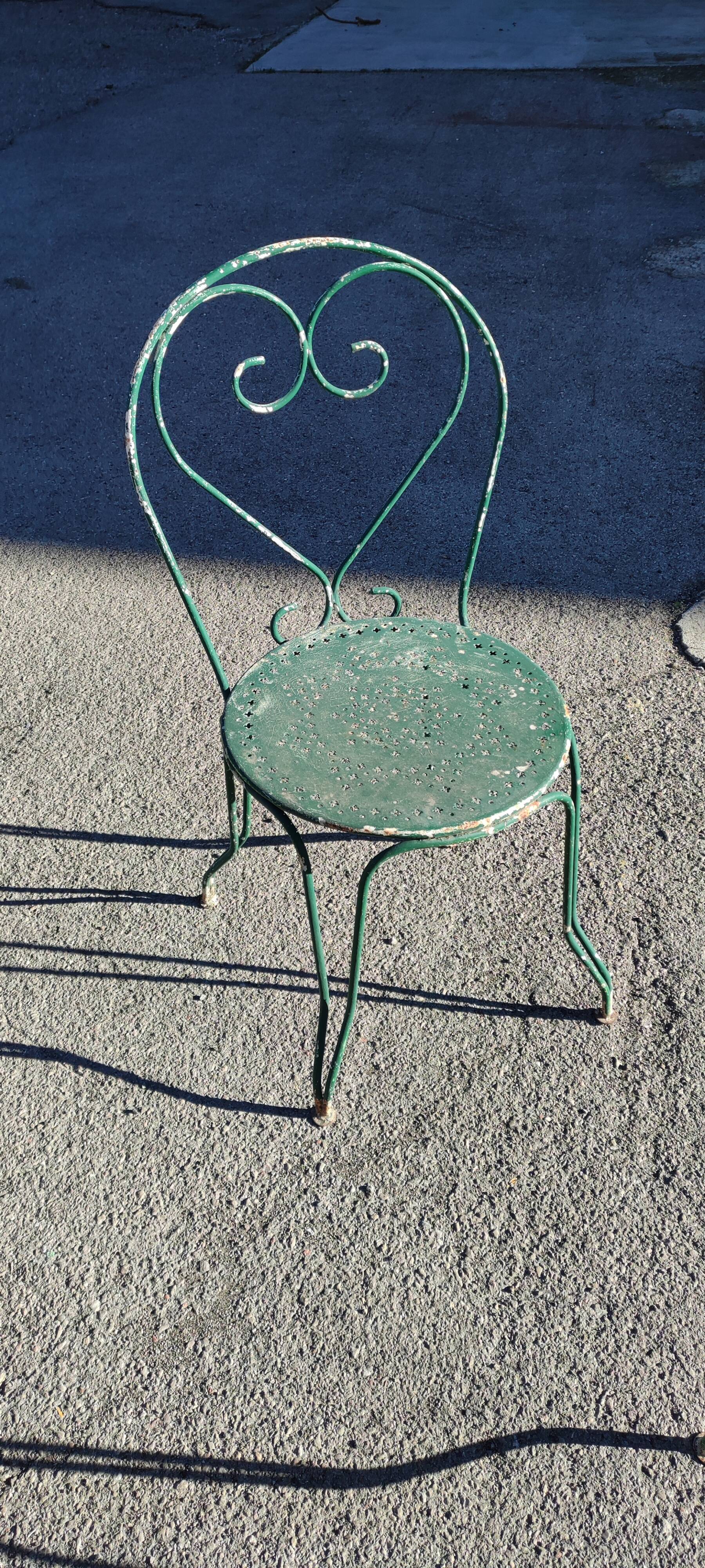 Garden table, two armchairs and a metal chair
