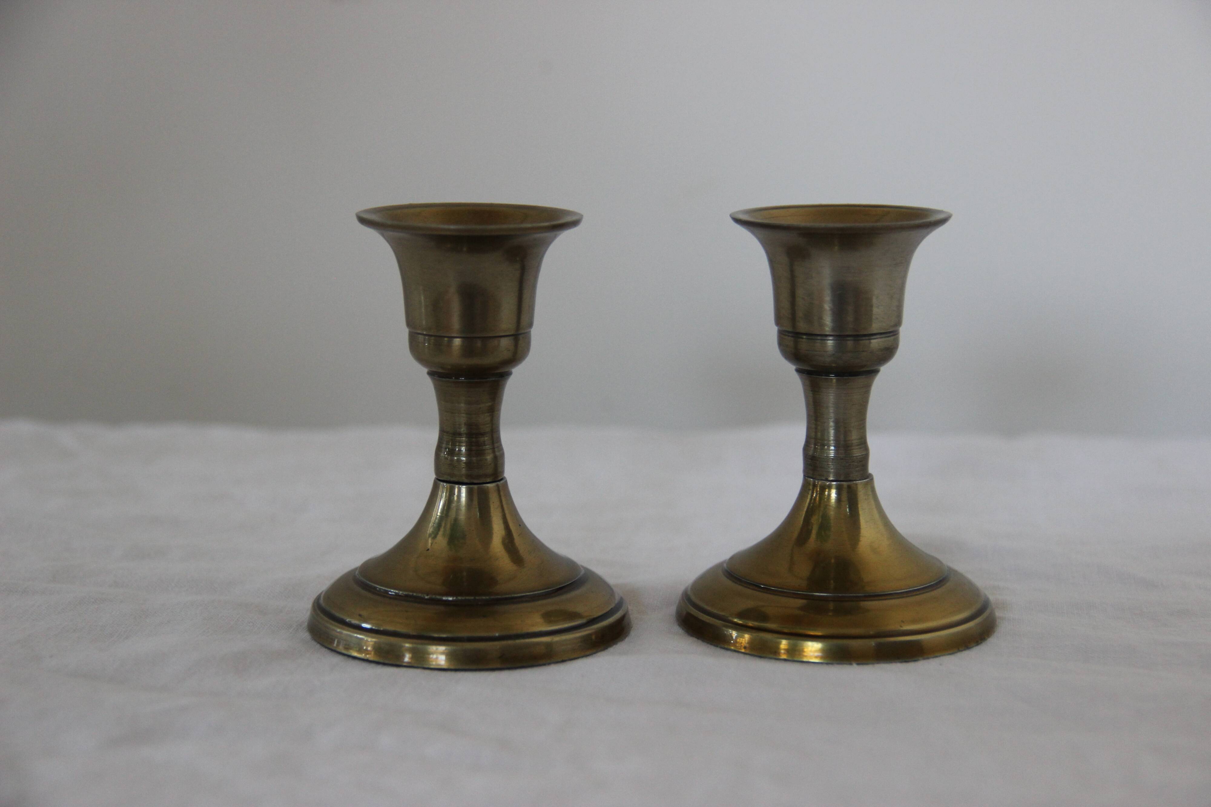 Small golden metal candle holders