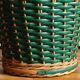 Cache-pot and its matching pencil holder in dyed woven rattan from the 1960s.