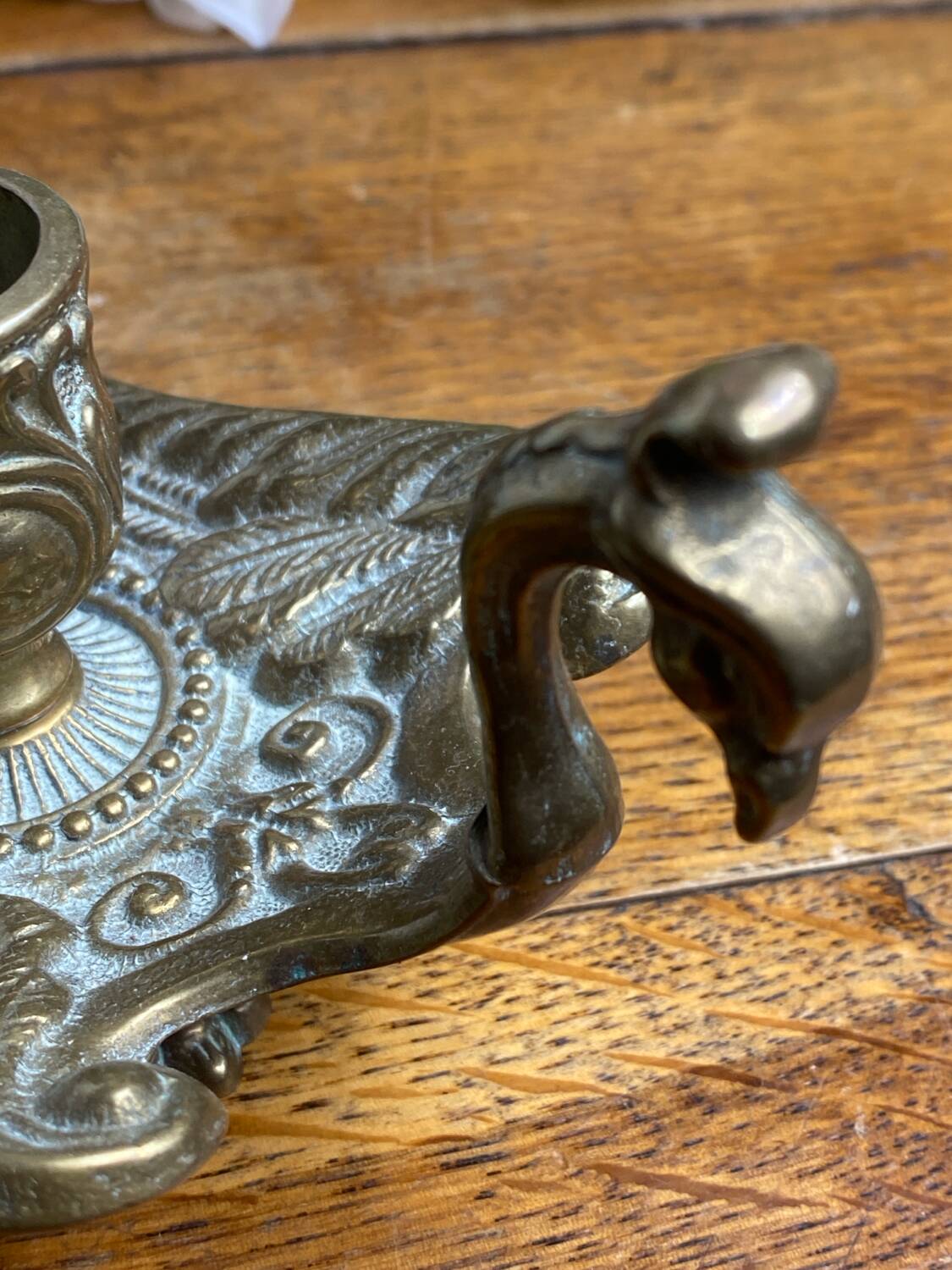 Hand candlestick, peacock shape, in bronze