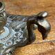 Hand candlestick, peacock shape, in bronze