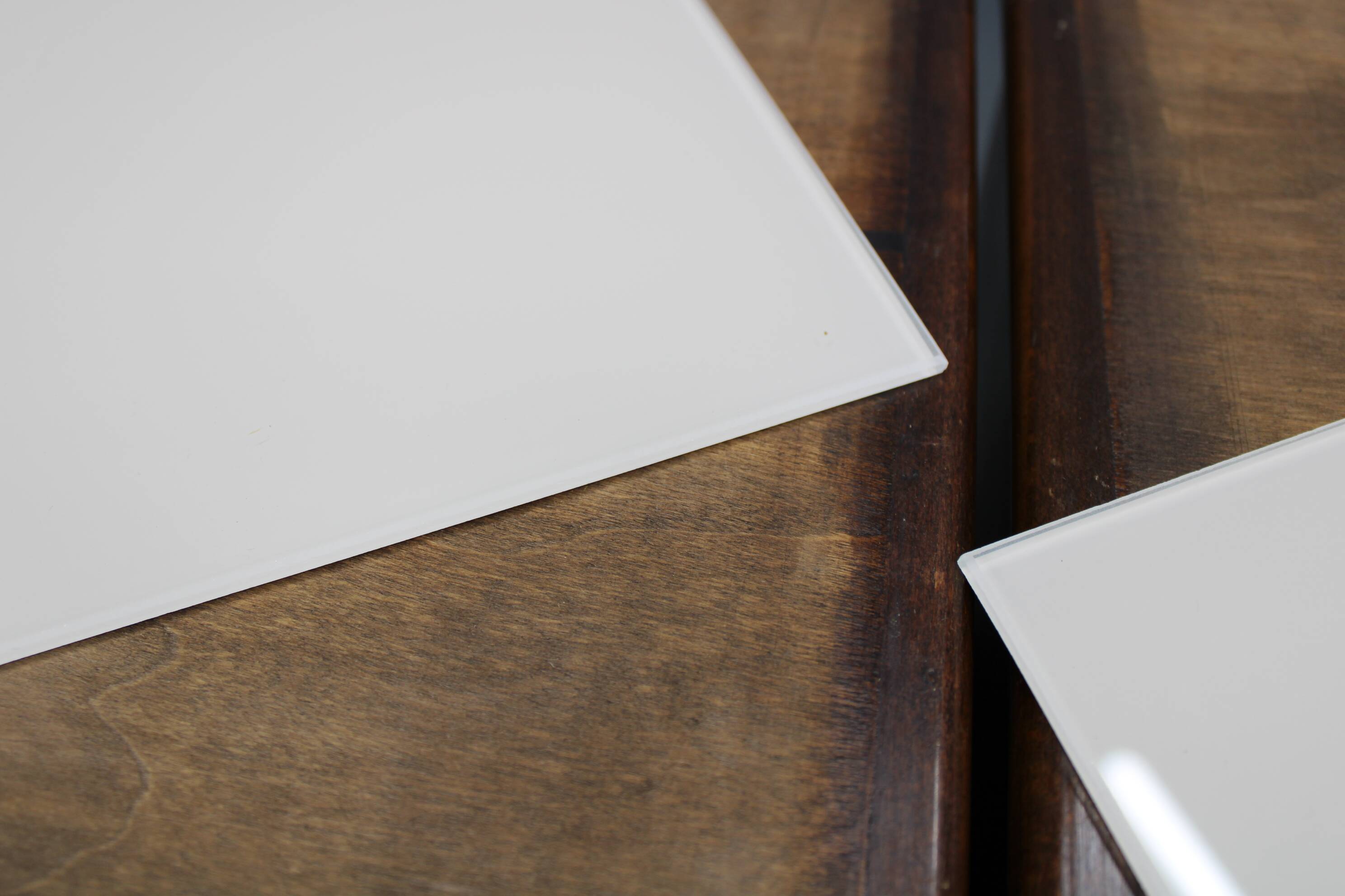 Pair of mid-century Italian walnut nightstands with glass top, 1950s