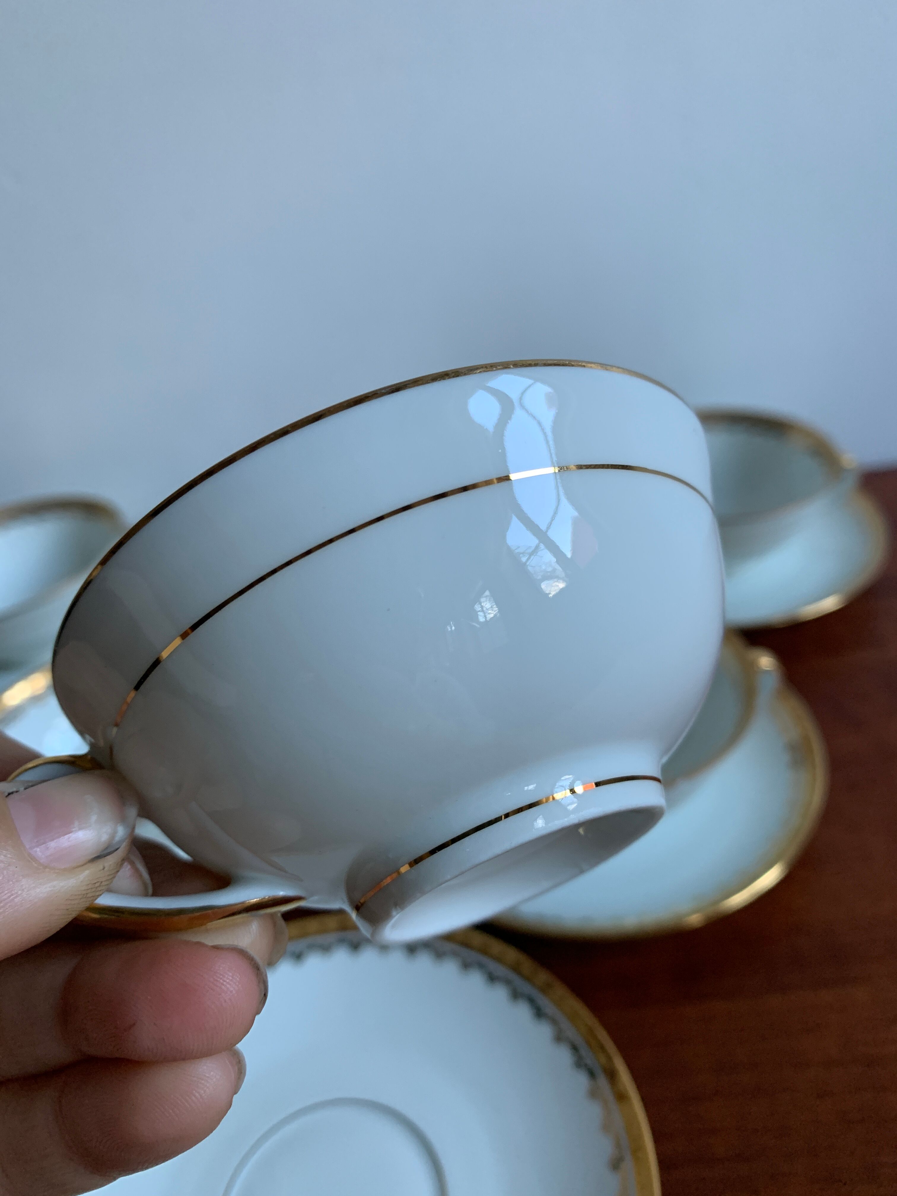 6 cups and golden porcelain saucers