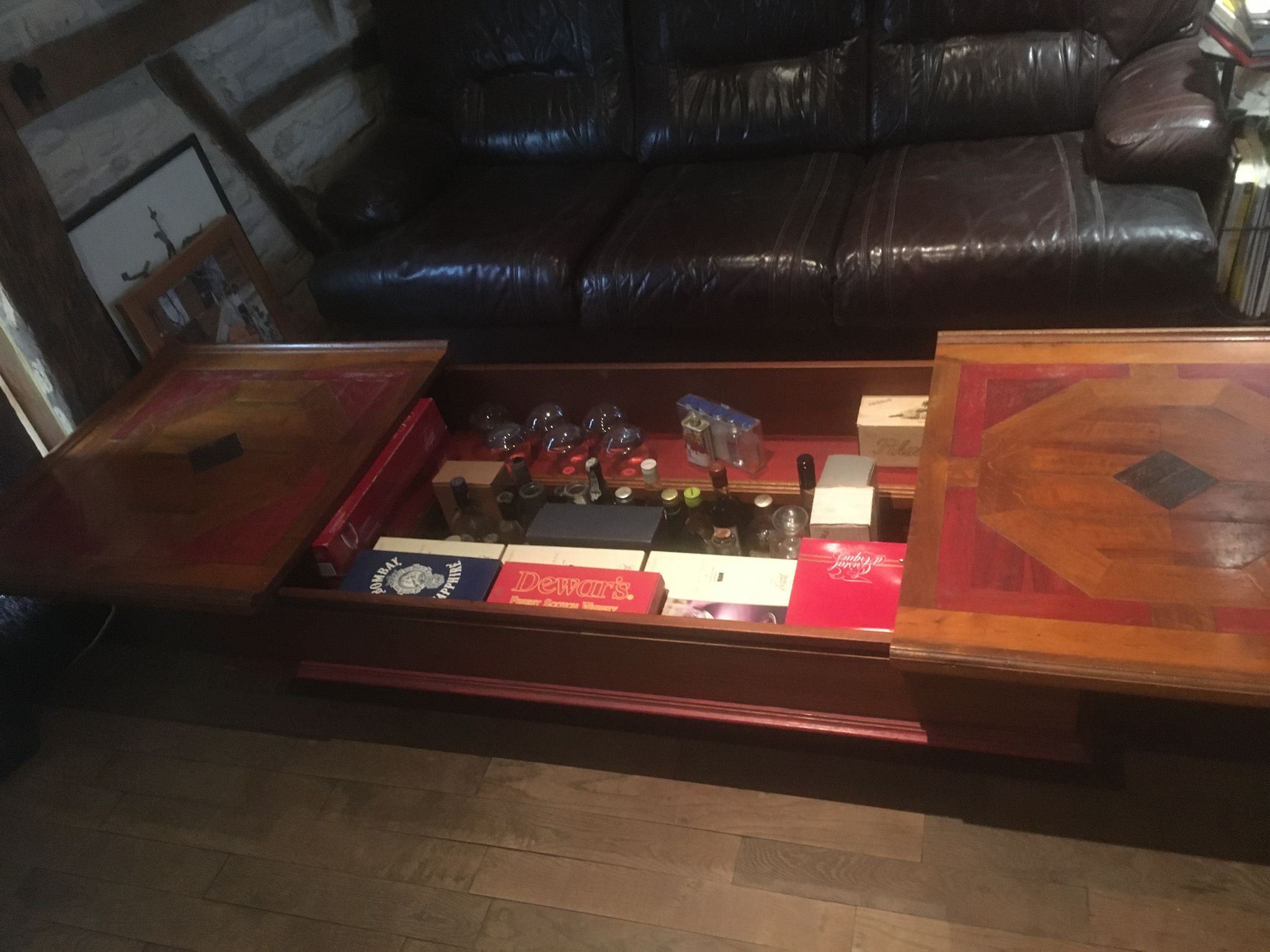 Coffee table with storage for bottles and glasses in oak.