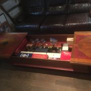 Coffee table with storage for bottles and glasses in oak.