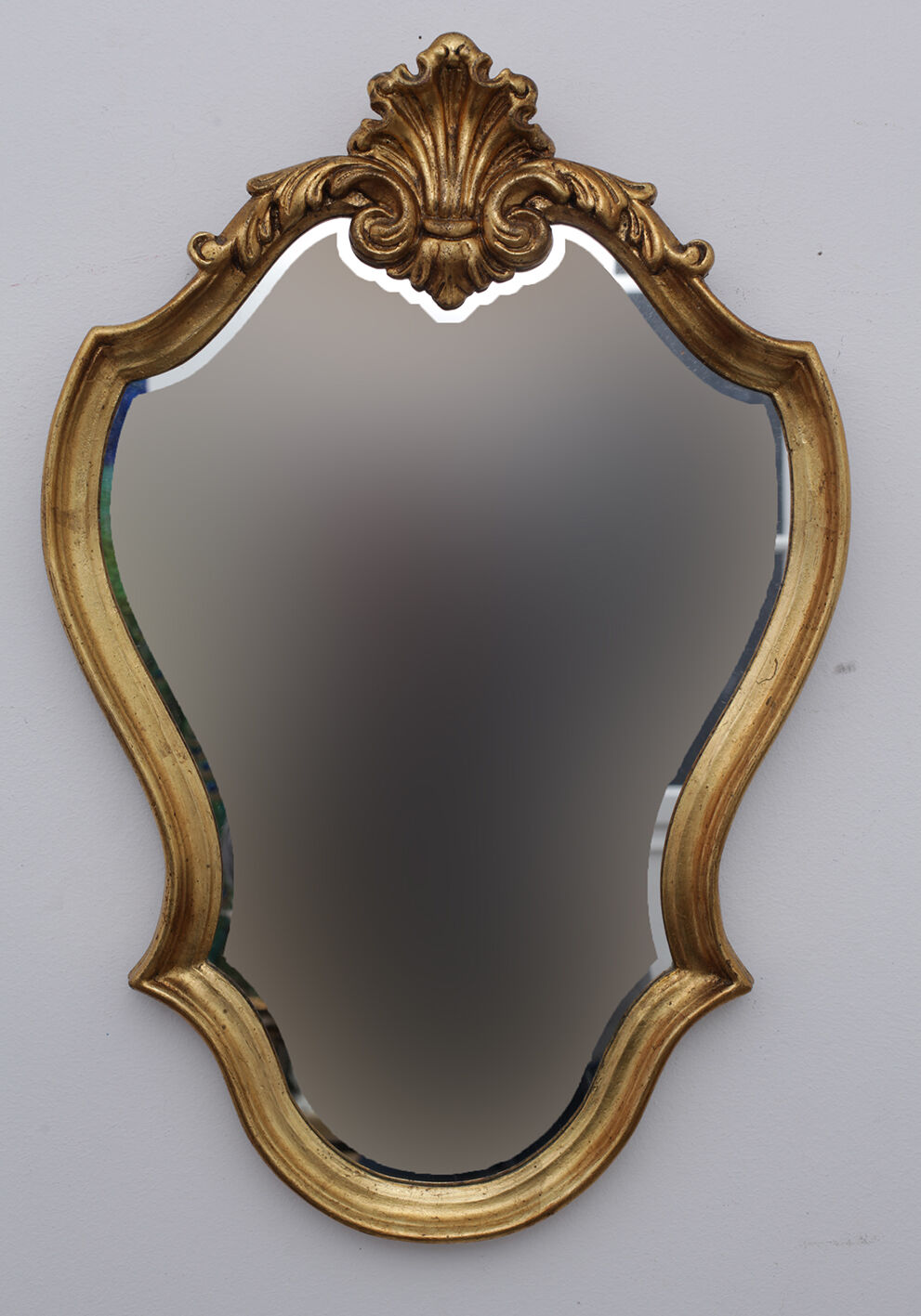 Golden rococo mirror with gold leaf
