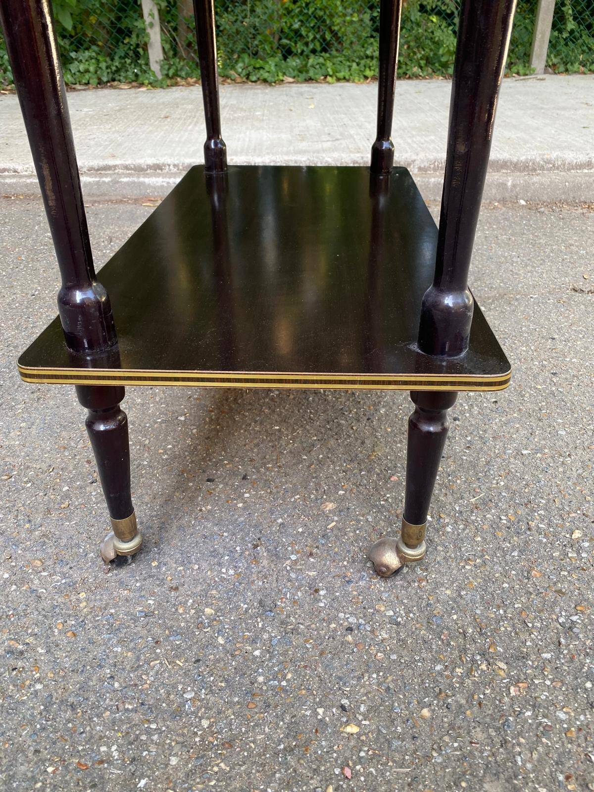 Double-tray rosewood serving trolley on gilded casters