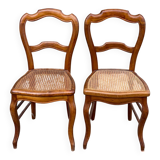 2 Louis Philippe caned chairs from the 19th century in solid wood.