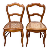 2 Louis Philippe caned chairs from the 19th century in solid wood.