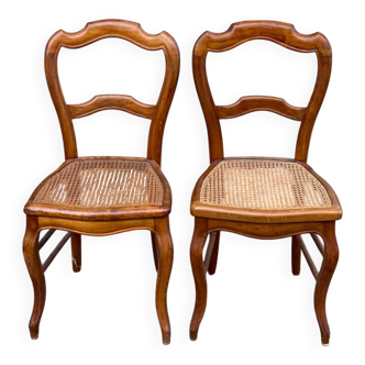 2 Louis Philippe caned chairs from the 19th century in solid wood.