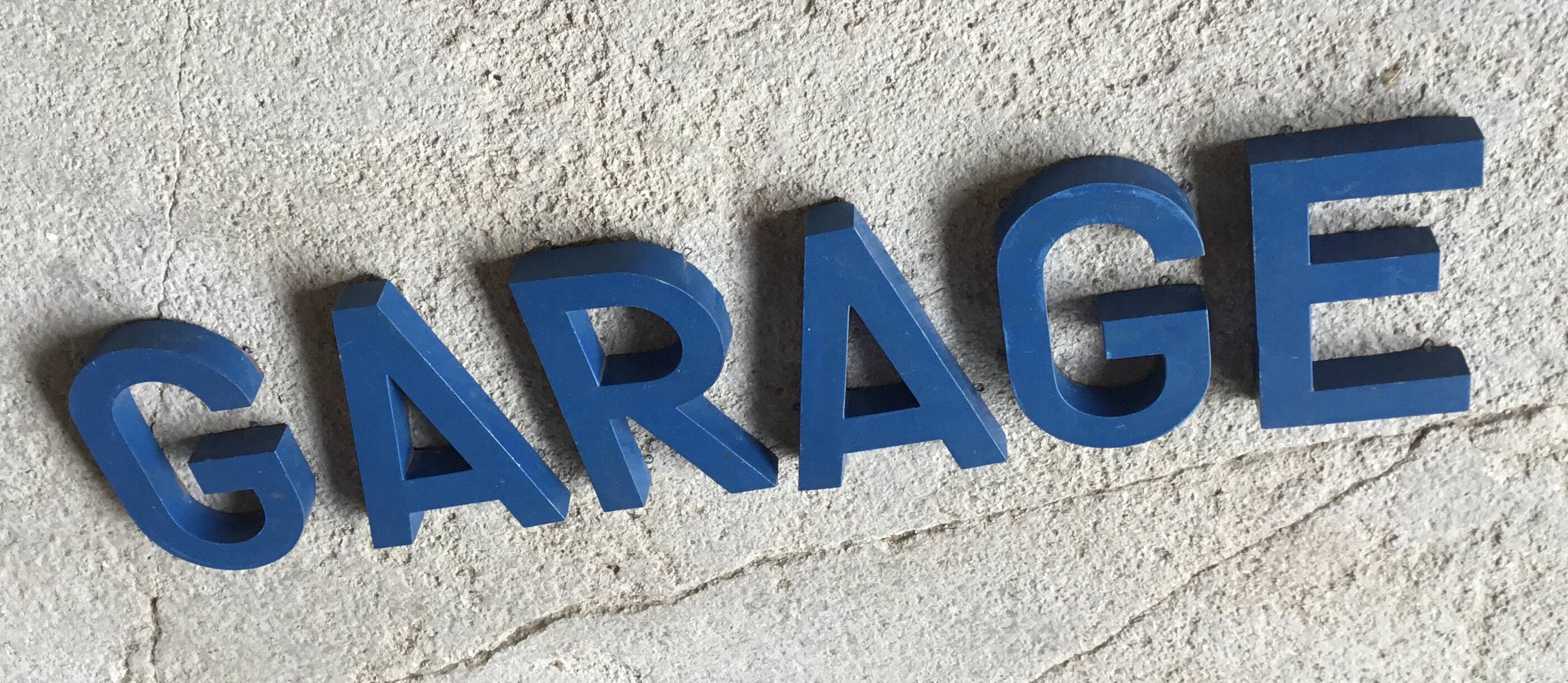 Metal sign letters forming the word GARAGE - vintage workshop