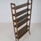 Danish freestanding wall rack with brass accents, 1960s