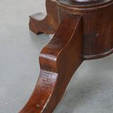 Wooden round 4-person dining table with detailed leg