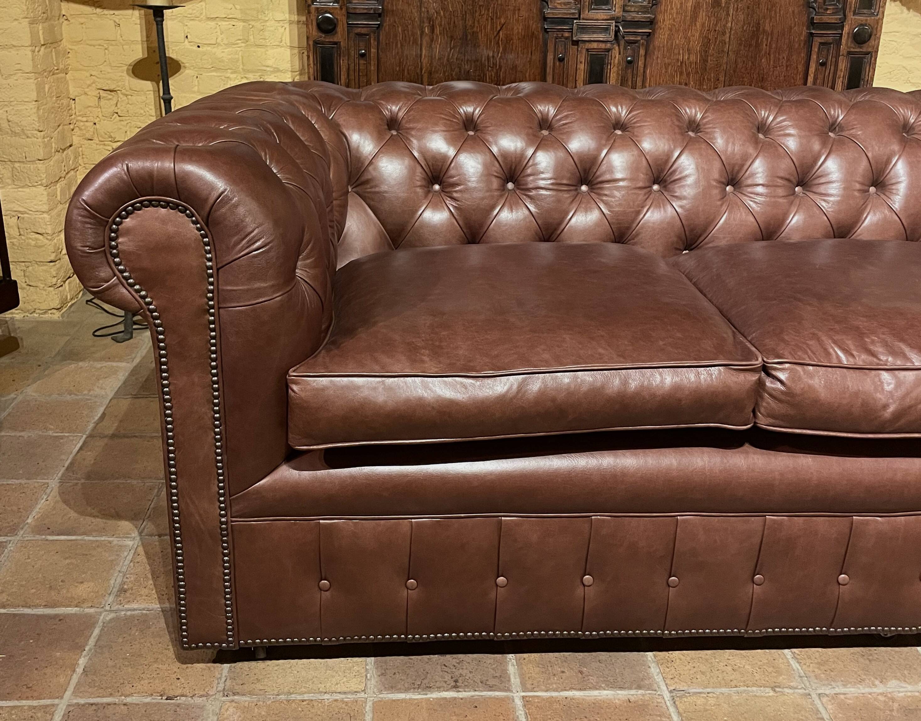 brown leather 3-seater Chesterfield sofa