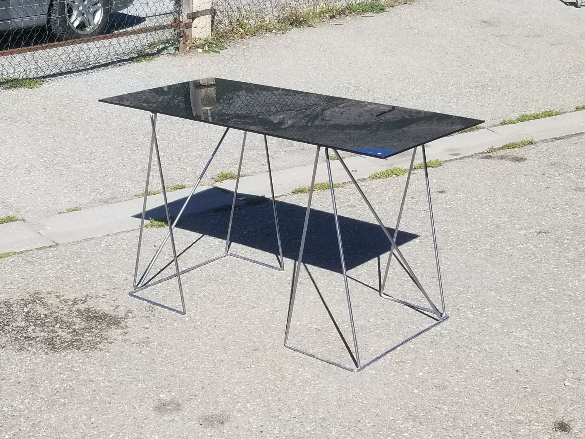 Vintage steel wire desk with chrome trestles and smoked glass top