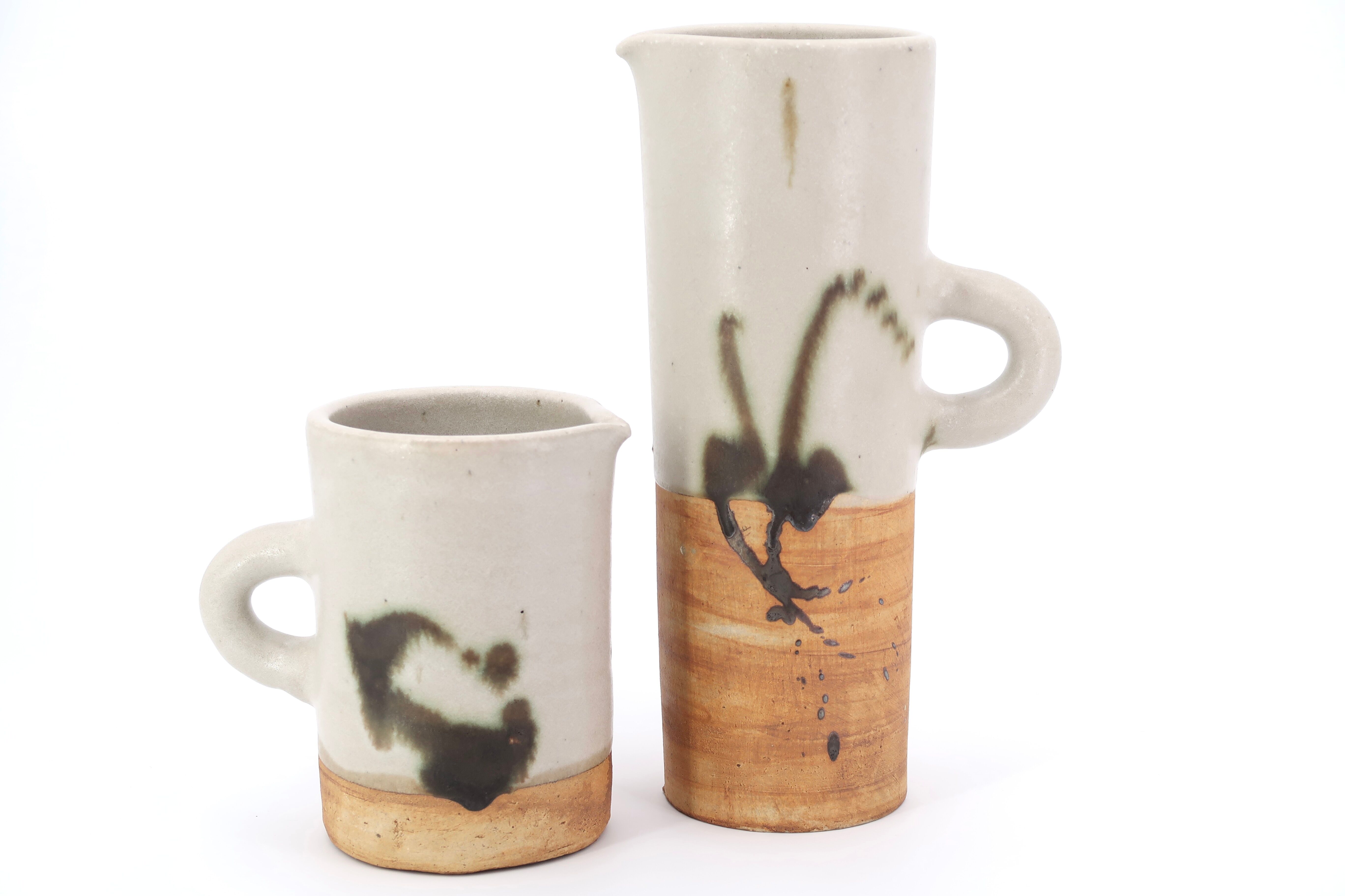 Two ceramic pitchers from the Dove pottery