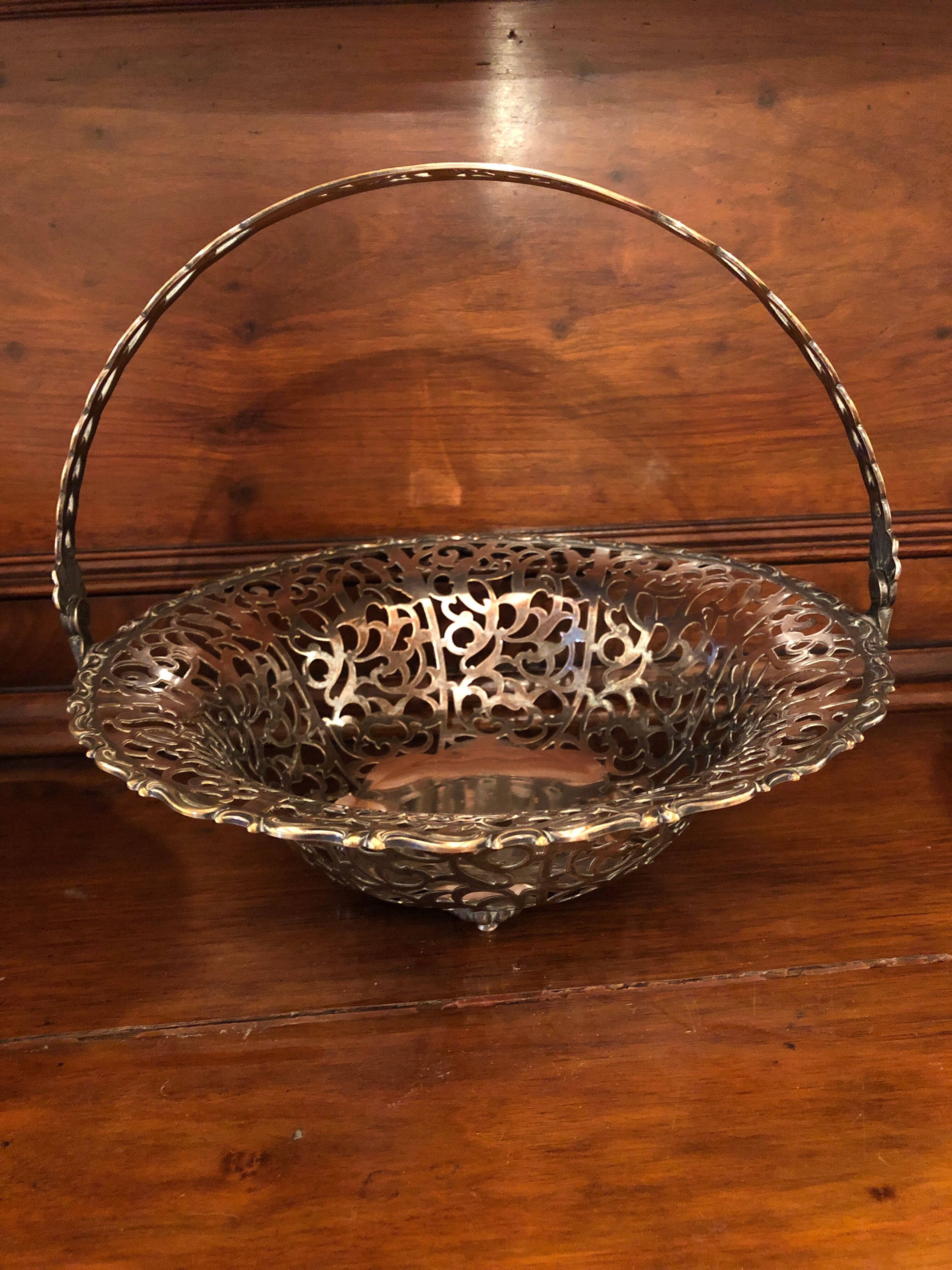 Open silver metal fruit basket