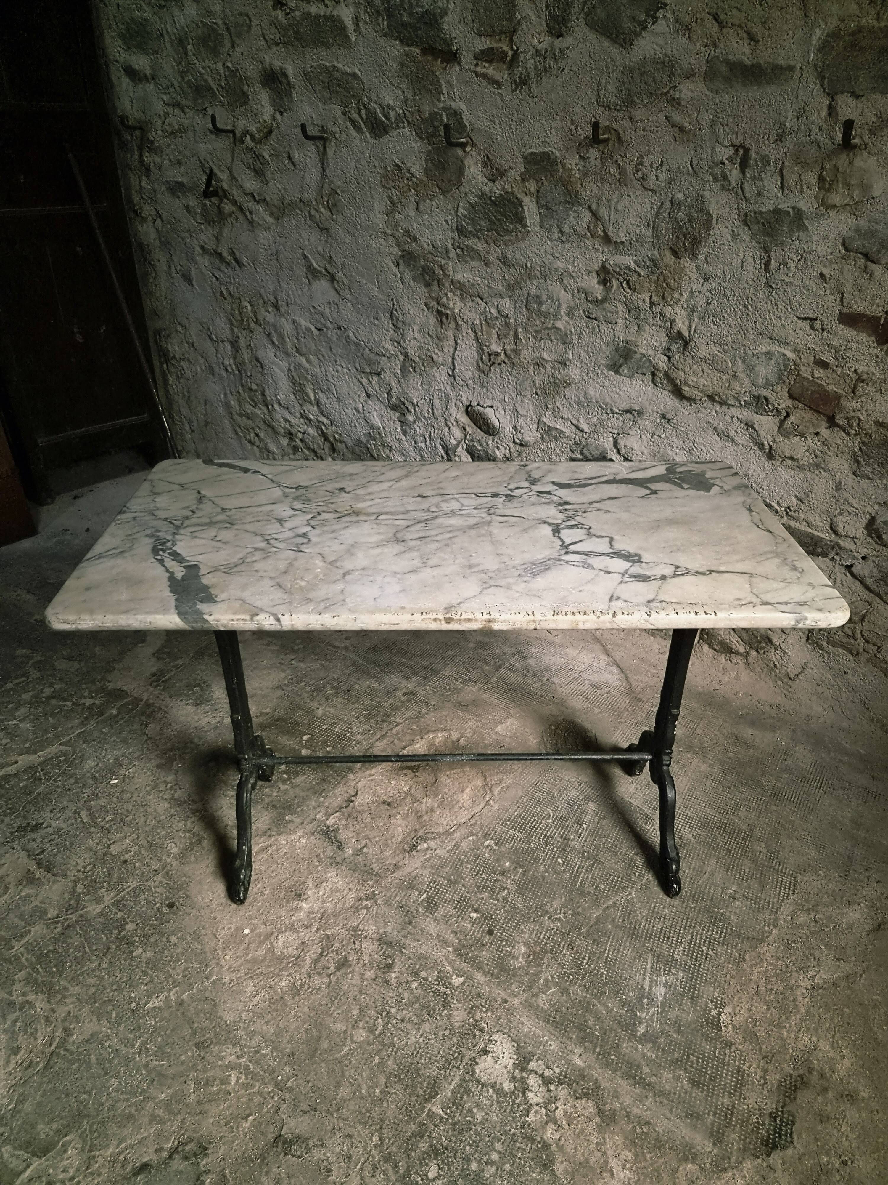 French bistro table made of marble with a cast iron base, 1920s–1930s.