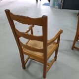 Two oak armchairs with straw seats
