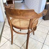 Bistro chair with a curved wooden frame and caned seat from the 1930s.