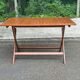 Foldable garden table in solid wood, signed 125x80cm.