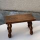 Footstool in varnished wood turns old
