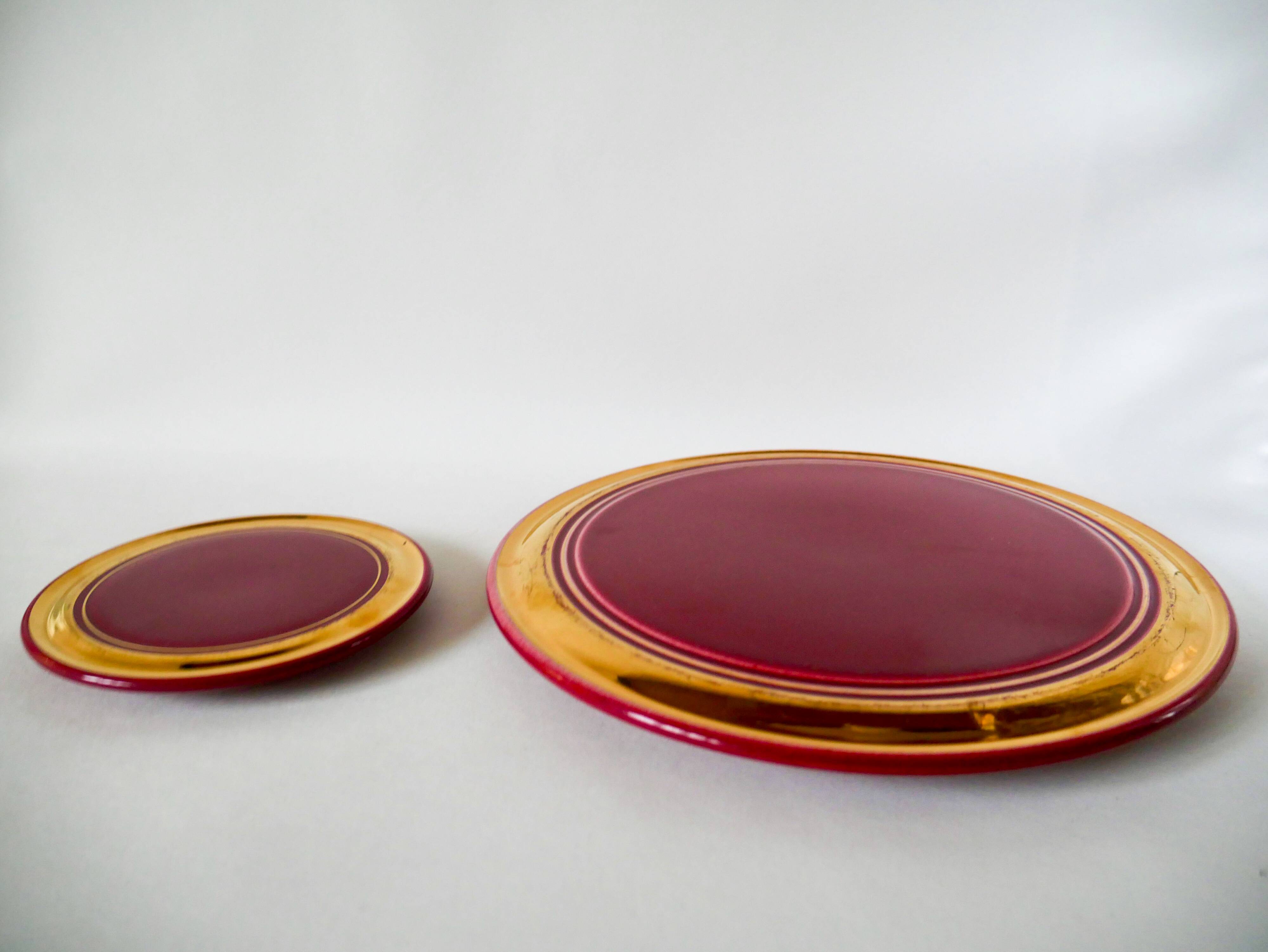 set of trivets, bottle coasters and knife holders in art de cherry-colored ceramic