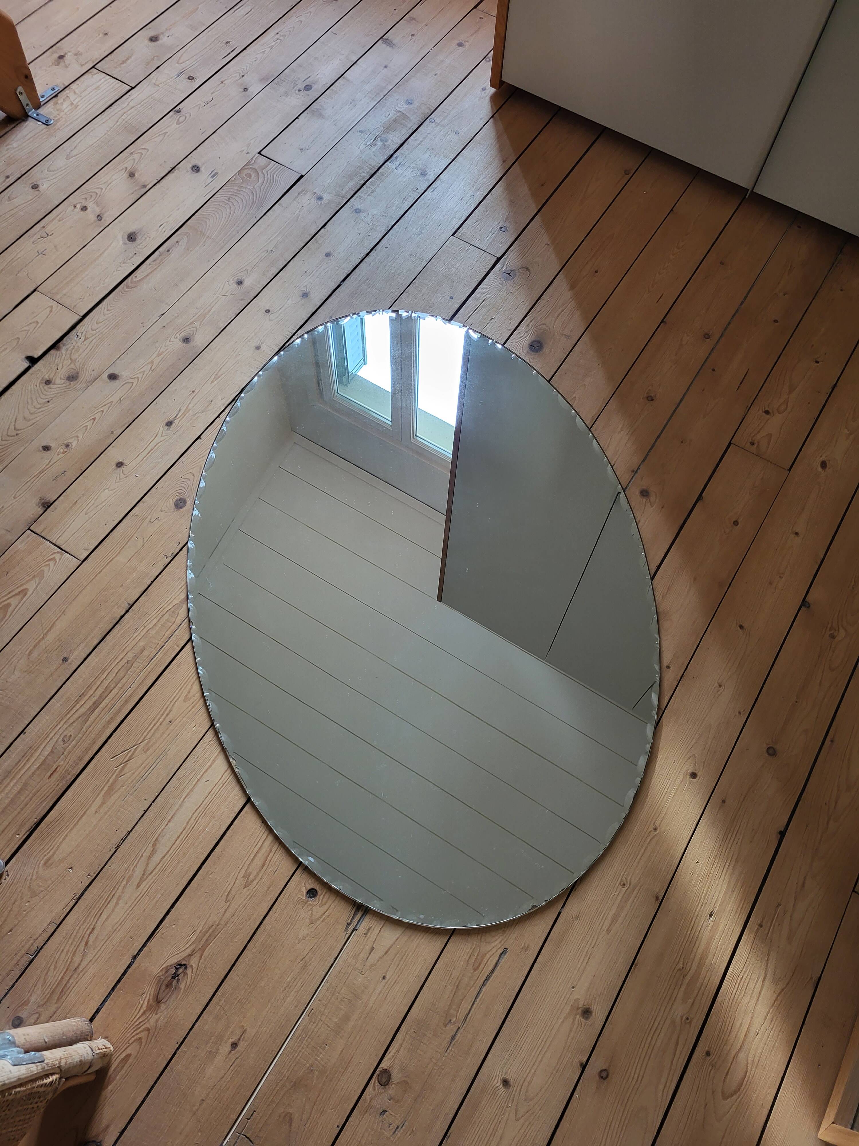 Large vintage beveled oval mirror